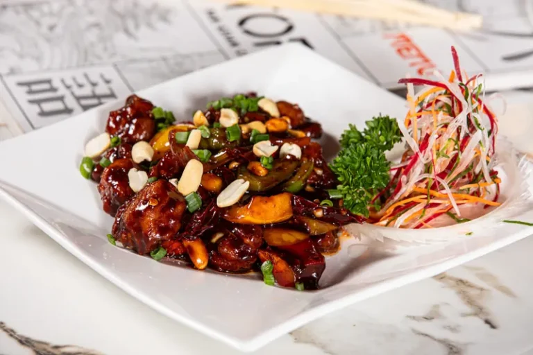 Spicy chicken stir fry with peanuts and fresh herbs