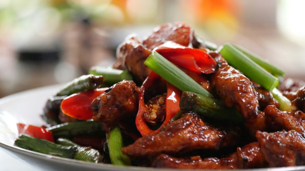Stir-fried meat with red peppers and scallions
